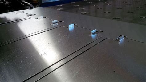 punching sheet metal tabs